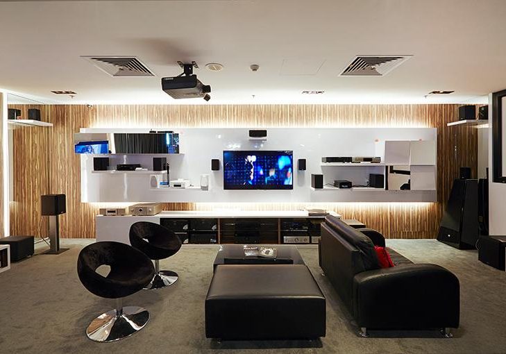 Denon Liang Court retail interior design demo area with sofas and mounted screens