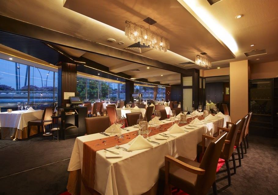 Le Saint Julien restaurant interior design long dining table with ceiling lighting